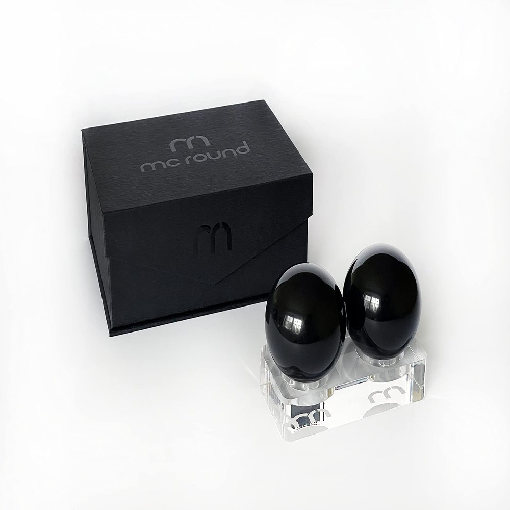 Two Black 48 mm Roundys for Hand Relaxation, with Acrylic Stand and Gift Box