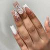 24 Medium-Length Pink and White Press-On Nails with Floral, Rhinestone & Crown Designs view 1