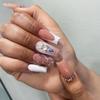 24 Medium-Length Pink and White Press-On Nails with Floral, Rhinestone & Crown Designs view 4